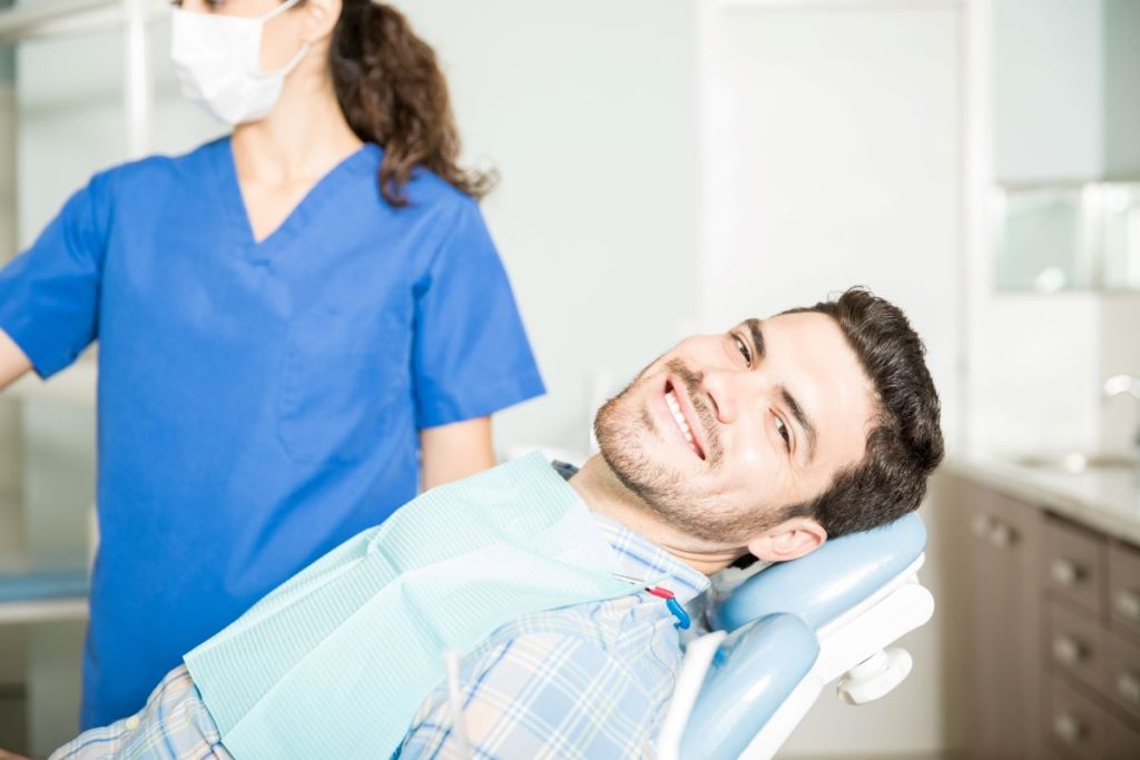 A relaxed patient during a professional Dental Hygiene appointment at Yonge Wellesley Dental in Toronto.