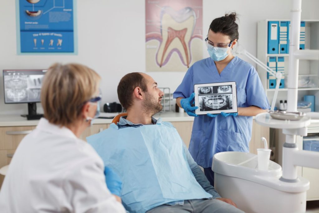 Oral cancer screening and digital X-ray review at Yonge Wellesley Dental in Toronto