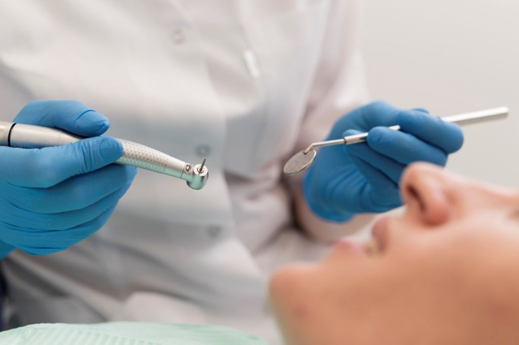 Root canal treatment tools held by a dentist at Yonge Wellesley Dental in Toronto